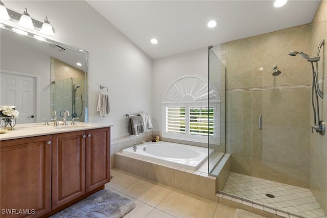 bathroom with shower with separate bathtub, tile patterned floors, and vanity