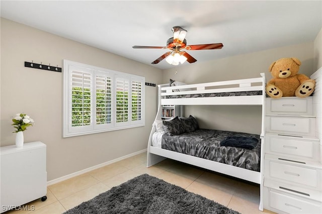 bedroom with light tile patterned floors and ceiling fan