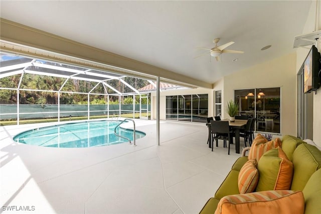 view of pool featuring an outdoor living space, a lanai, ceiling fan, and a patio area