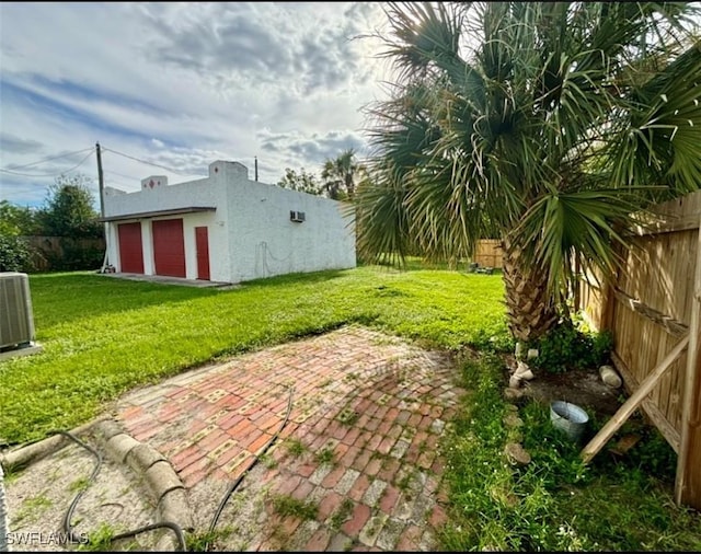 view of yard featuring central AC