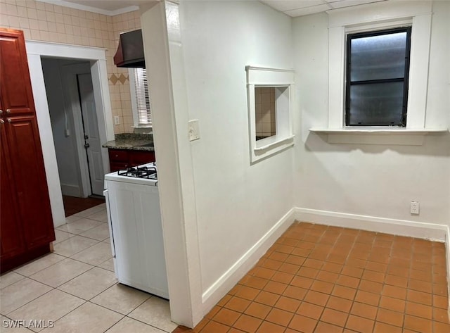 hall featuring light tile patterned floors