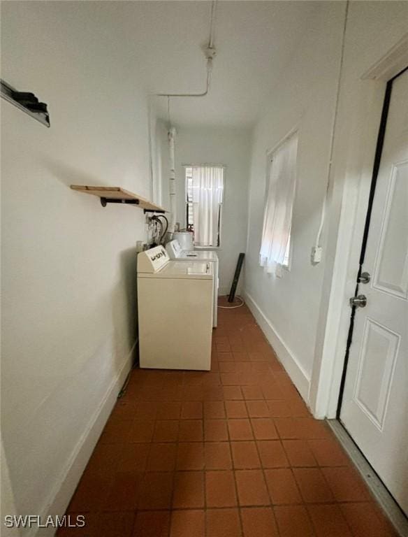 laundry room with washing machine and clothes dryer