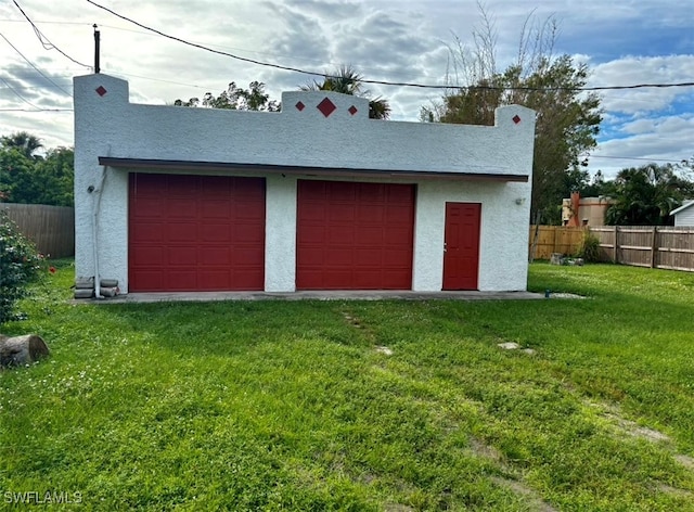 garage with a yard