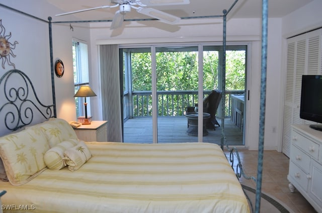 bedroom with ceiling fan, light tile patterned flooring, access to outside, and a closet