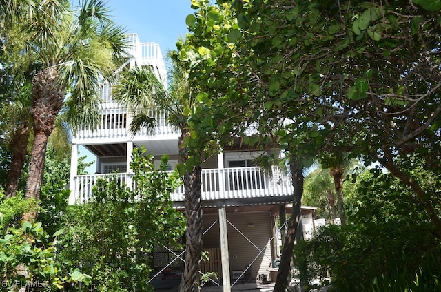 rear view of property with a balcony