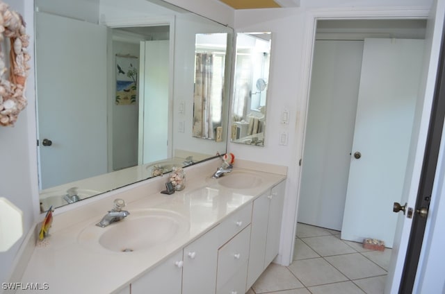 bathroom featuring tile patterned flooring and vanity