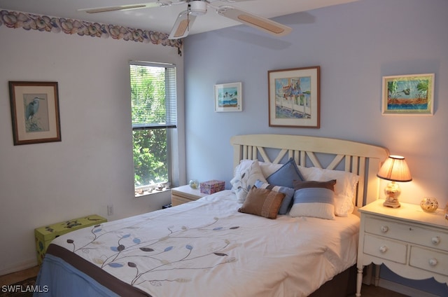 bedroom featuring multiple windows and ceiling fan