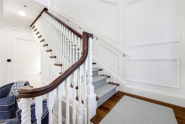 staircase featuring hardwood / wood-style floors