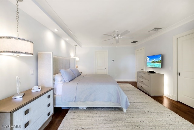 bedroom with ceiling fan, dark hardwood / wood-style flooring, and ornamental molding