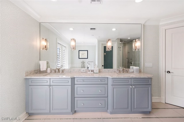 bathroom with tile patterned flooring, vanity, ornamental molding, and walk in shower