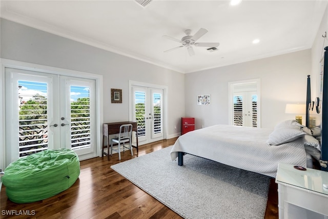 bedroom with dark hardwood / wood-style flooring, multiple windows, access to outside, and french doors