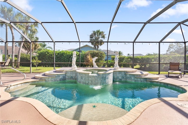 view of swimming pool featuring a patio area, a lanai, and an in ground hot tub