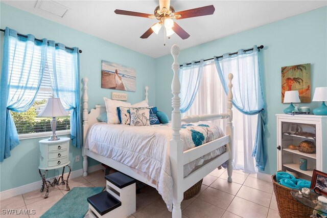 tiled bedroom with ceiling fan