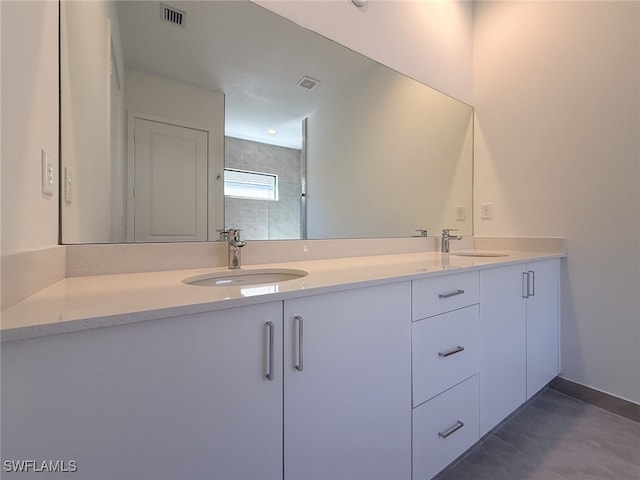 bathroom with vanity and walk in shower