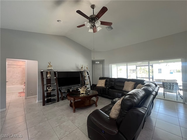 tiled living room featuring ceiling fan and lofted ceiling