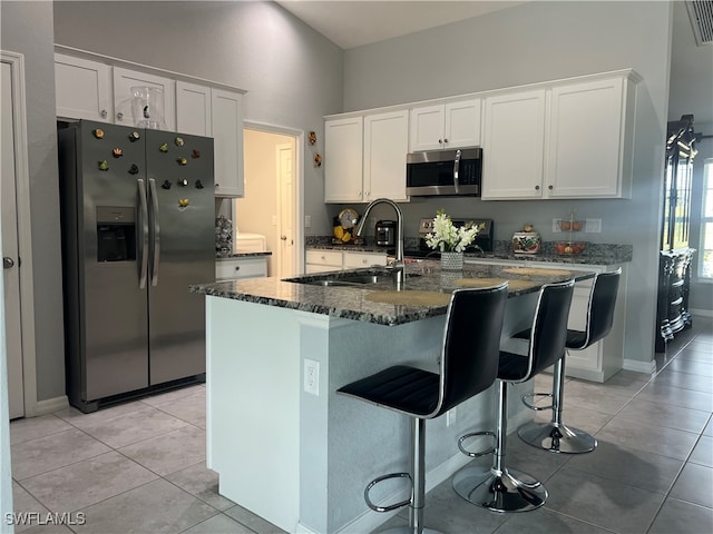 kitchen featuring white cabinetry, sink, a kitchen island with sink, and appliances with stainless steel finishes