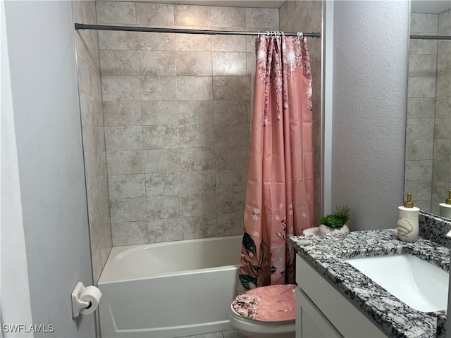 full bathroom featuring shower / tub combo with curtain, vanity, and toilet