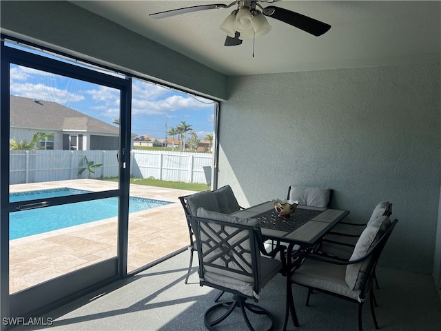 sunroom / solarium with ceiling fan