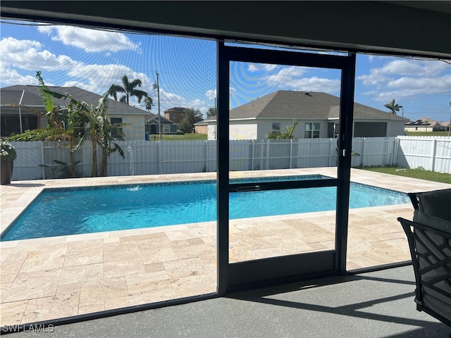 view of swimming pool featuring a patio area