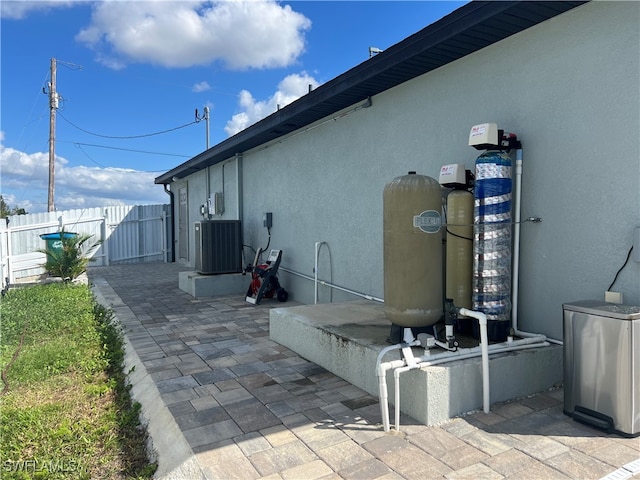 view of side of home featuring central AC