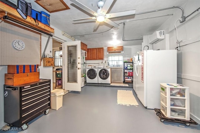 basement featuring ceiling fan, white refrigerator, washing machine and dryer, and a wall mounted AC