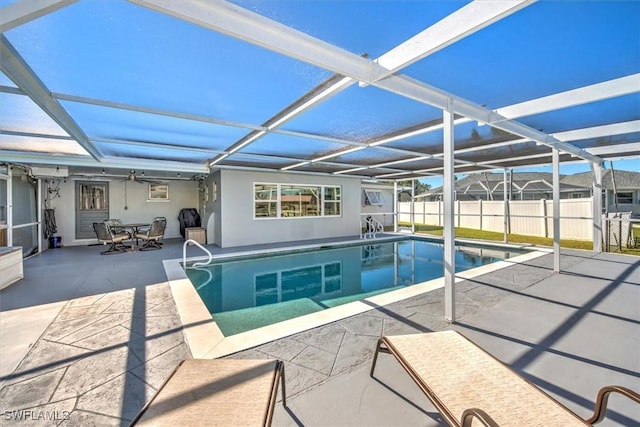 view of pool featuring a lanai and a patio