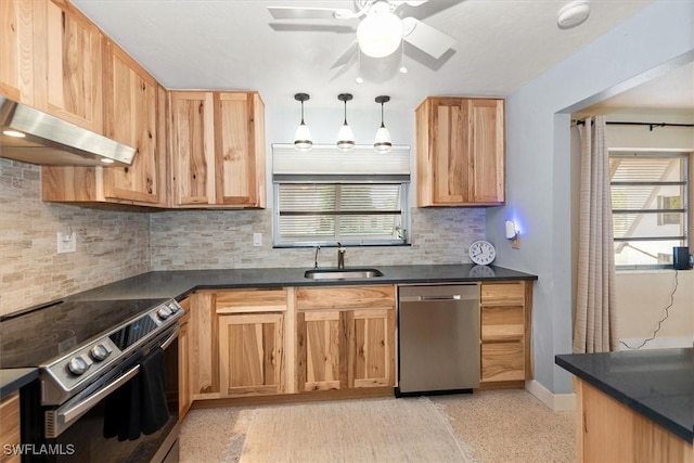 349 Coral Dr, Fort Myers, FL 33905 - kitchen with stainless steel appliances, a sink, dark countertops, decorative backsplash, and baseboards
