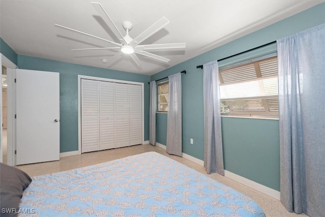 349 Coral Dr, Fort Myers, FL 33905 - bedroom with baseboards, speckled floor, ceiling fan, and a closet