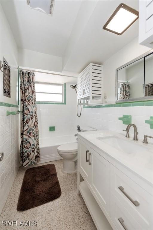 349 Coral Dr, Fort Myers, FL 33905 - bathroom with tile walls, toilet, vanity, shower / bathtub combination with curtain, and speckled floor