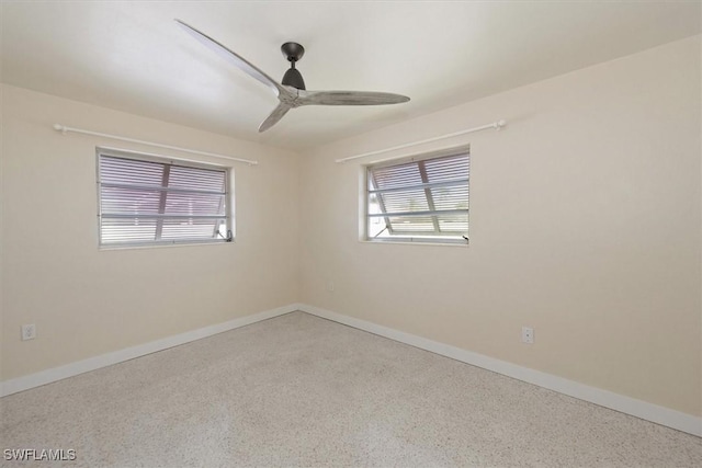 349 Coral Dr, Fort Myers, FL 33905 - spare room with plenty of natural light, speckle patterned floor, and baseboards