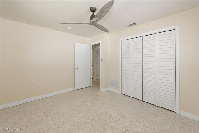 349 Coral Dr, Fort Myers, FL 33905 - unfurnished bedroom with speckled floor, baseboards, ceiling fan, and a closet