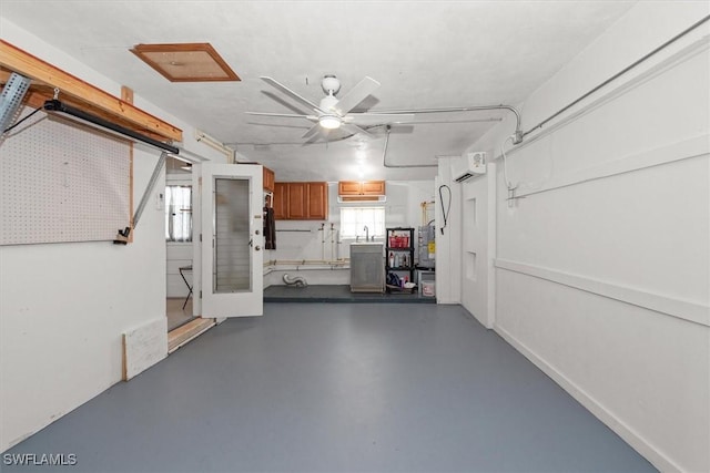 349 Coral Dr, Fort Myers, FL 33905 - garage featuring ceiling fan and a sink