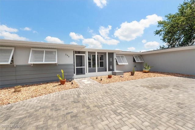 349 Coral Dr, Fort Myers, FL 33905 - view of front facade with a sunroom