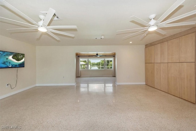 349 Coral Dr, Fort Myers, FL 33905 - unfurnished living room featuring speckled floor, ceiling fan, and baseboards
