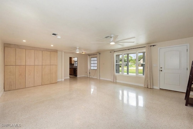 349 Coral Dr, Fort Myers, FL 33905 - unfurnished living room with ceiling fan, dark aggregate flooring, baseboards, and recessed lighting