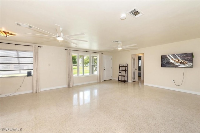 349 Coral Dr, Fort Myers, FL 33905 - unfurnished living room featuring dark aggregate flooring, ceiling fan, and baseboards