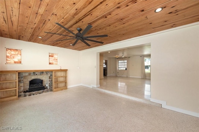 349 Coral Dr, Fort Myers, FL 33905 - unfurnished living room with a ceiling fan, wood ceiling, baseboards, a fireplace with raised hearth, and recessed lighting