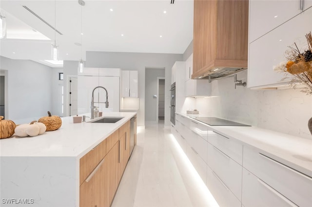 kitchen with white cabinetry, sink, dishwasher, hanging light fixtures, and black electric stovetop