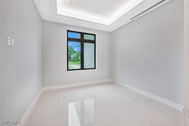 empty room with a tray ceiling