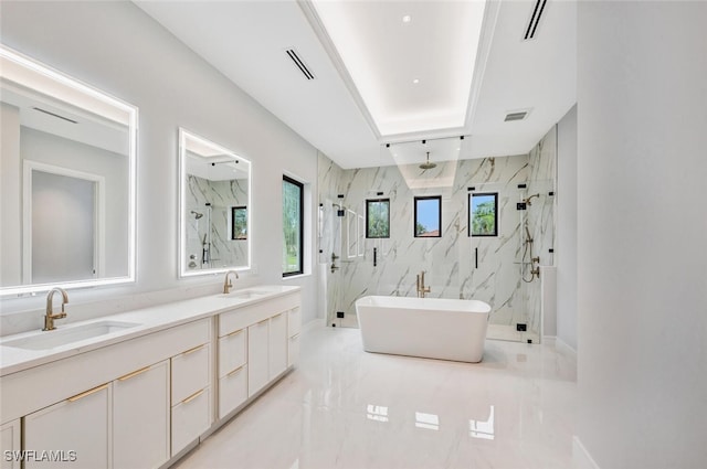 bathroom featuring vanity and independent shower and bath