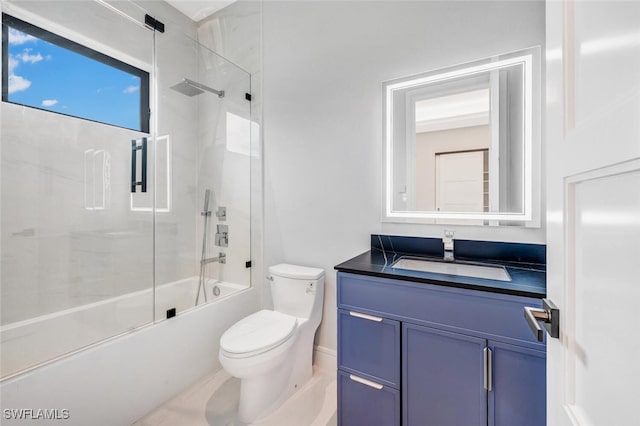 full bathroom featuring vanity, toilet, and combined bath / shower with glass door