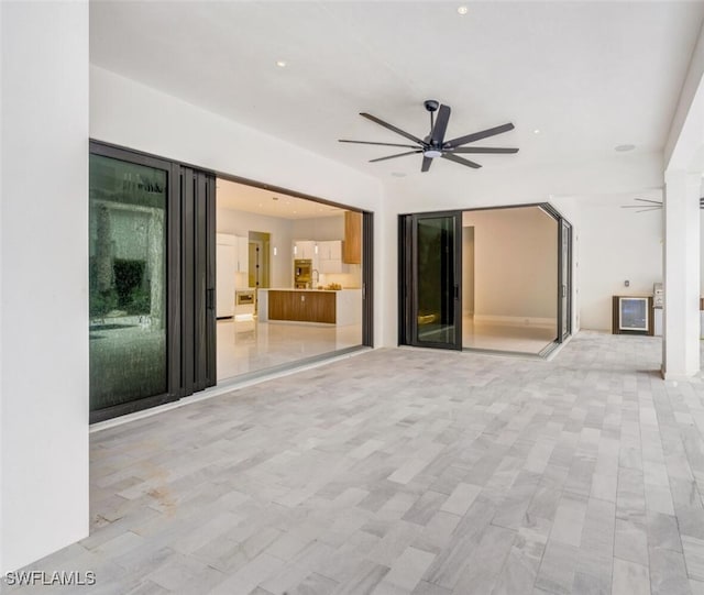 interior space featuring ceiling fan