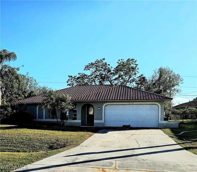 view of front facade with a garage and a front lawn