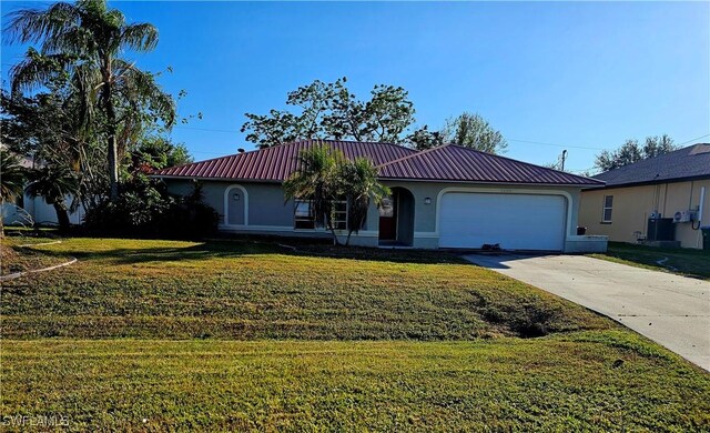 single story home featuring a front yard and a garage