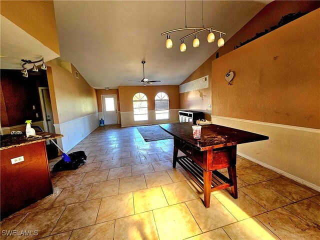 interior space featuring ceiling fan and vaulted ceiling