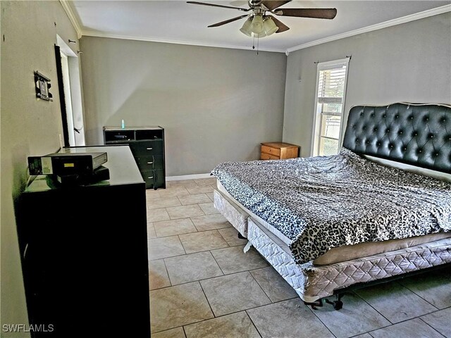 tiled bedroom featuring ceiling fan and crown molding