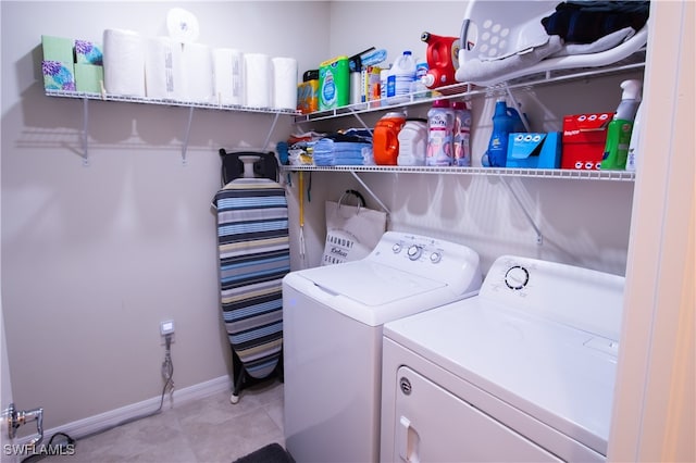 clothes washing area featuring separate washer and dryer