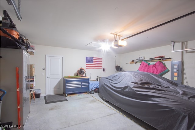 bedroom featuring electric panel and concrete flooring