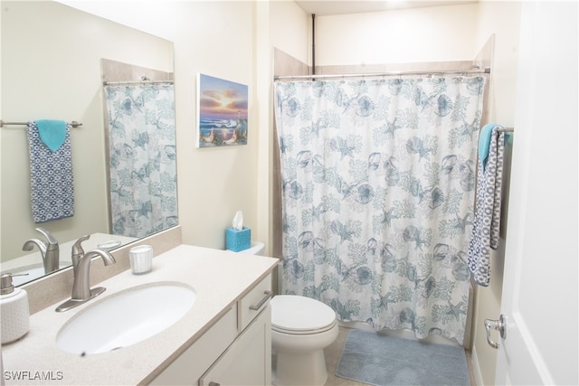 bathroom with a shower with curtain, vanity, and toilet