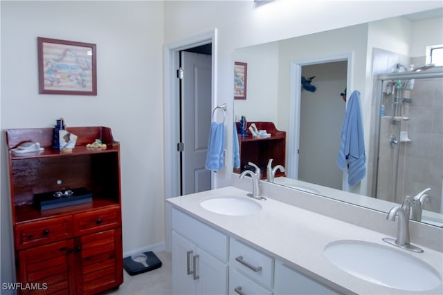 bathroom with a shower with door and vanity